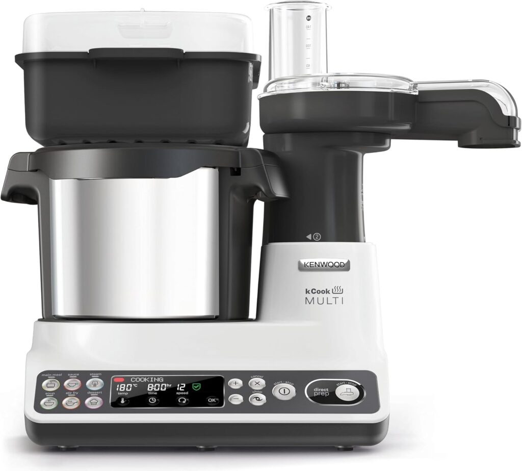 Robot da cucina Kenwood kCook Multi su piano di lavoro. Vista laterale che mostra il corpo macchina in metallo, il display digitale e l'accessorio Direct Prep per il taglio delle verdure.